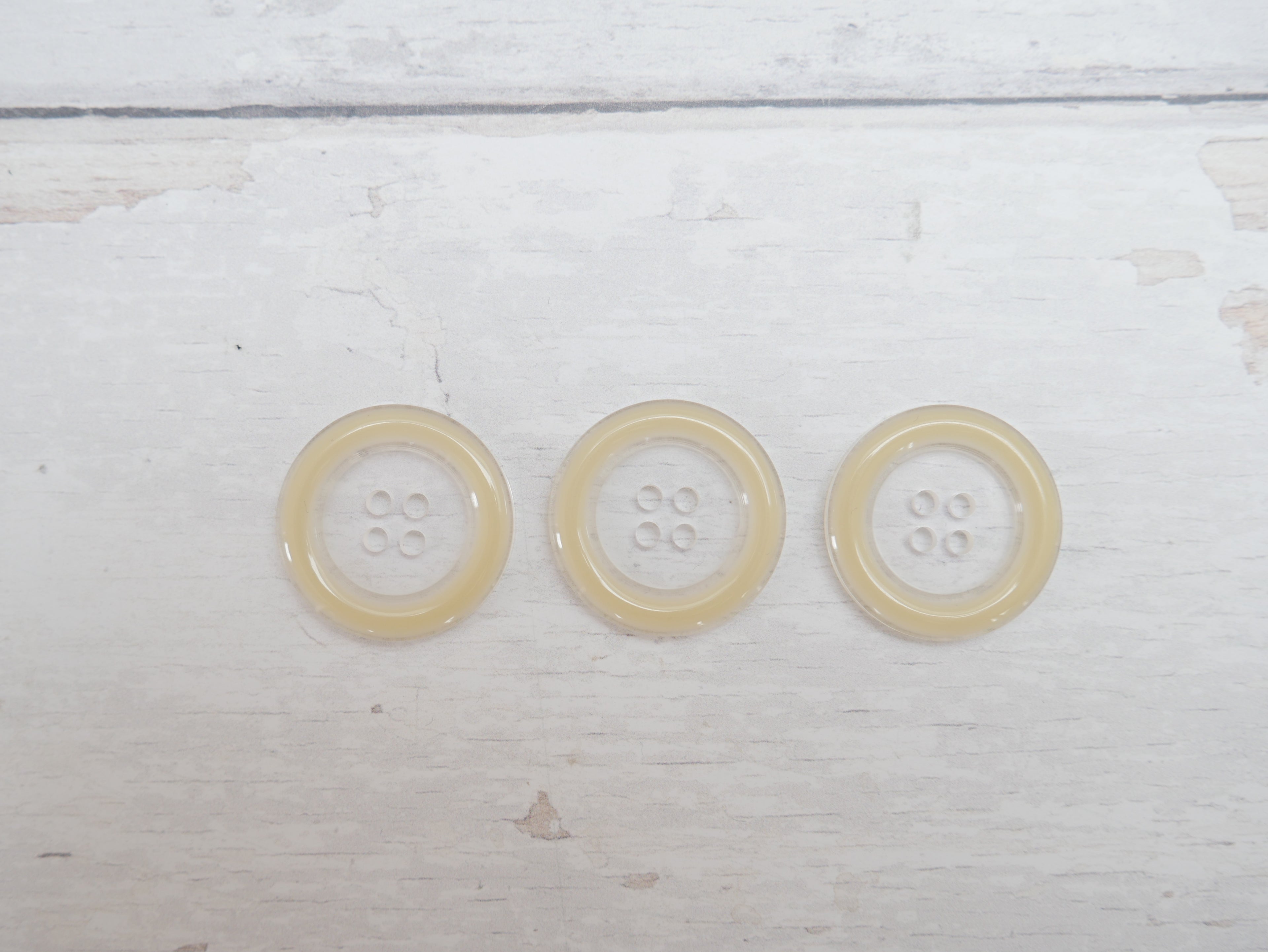 Clear, 25mm Coloured Rim 4-Hole Button in Cream-Button-Flying Bobbins Haberdashery